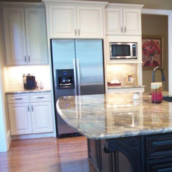 Custom Quality Design Cabinets — Elegant Kitchen with Marble Countertop and White Cabinets in Matthews, NC
