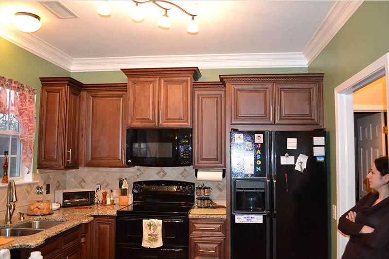 Quality Cabinet Installation — Newly Installed Wooden Cabinet in Furnished Kitchen in Matthews, NC