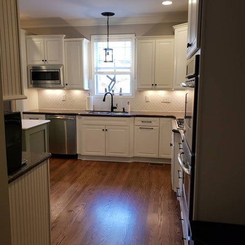 North Carolina Kitchen Remodeling — Kitchen with White Cabinets in Matthews, NC