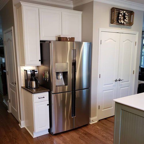 North Carolina New Kitchen Remodeling — Opposite View of Kitchen with White Cabinets in Matthews, NC