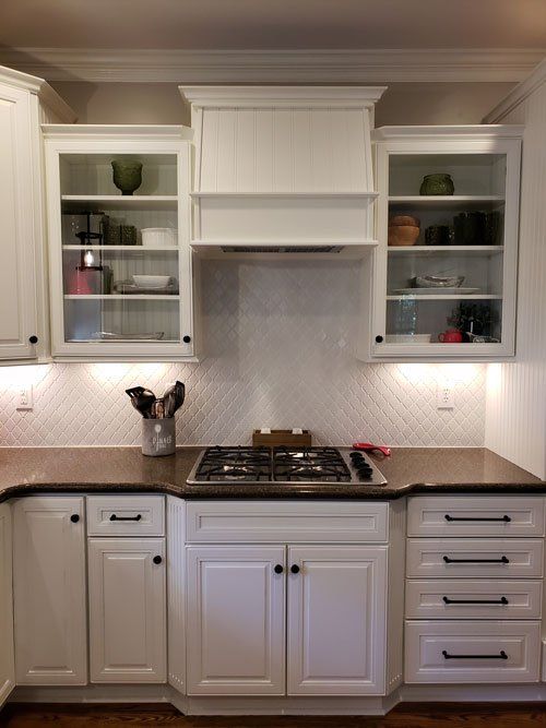 Kitchen Cabinet Remodeling — Kitchen with White Cabinets and Ventilation in Matthews, NC