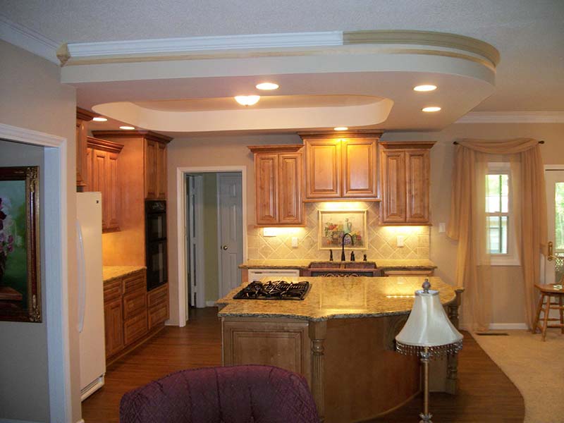 Kitchen — Kitchen with Marble Countertops and Wooden Cabinets in Matthews, NC