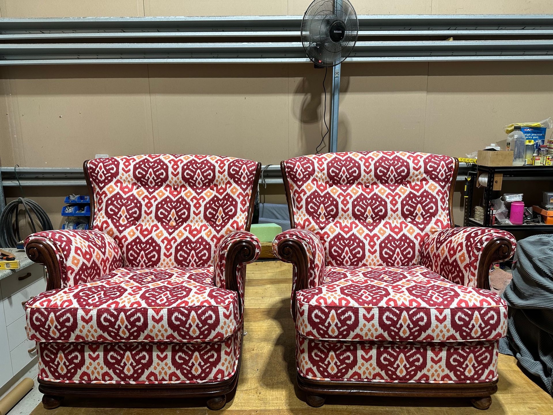 Two Black Leather Recliner Chairs Are Next to Each Other in a Room — Paulie's Upholstery in Palm Cove, QLD