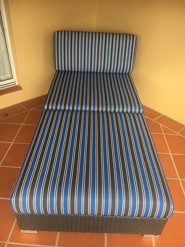 A Blue and Black Striped Chaise Lounge on a Tiled Floor — Paulie's Upholstery in Gordonvale, QLD