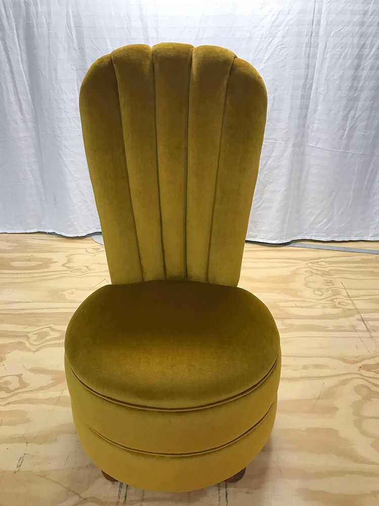 A Yellow Chair is on a Wooden Floor — Paulie's Upholstery in Edmonton, QLD