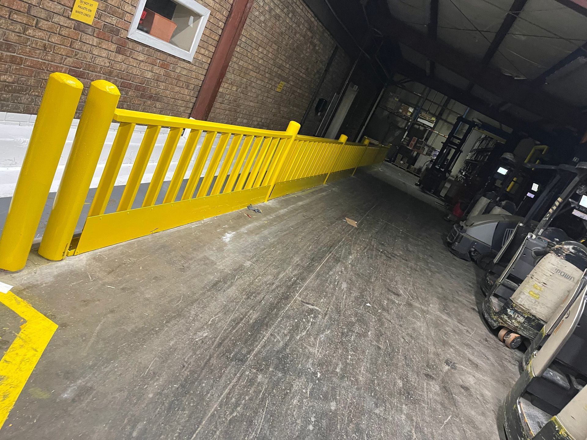 A person is using a hammer to remove tiles from the floor.