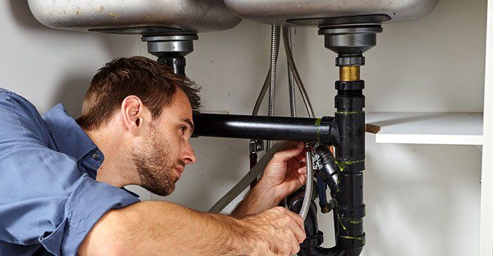 Emergency Plumber — Plumber With Tools in St. Paul, MN