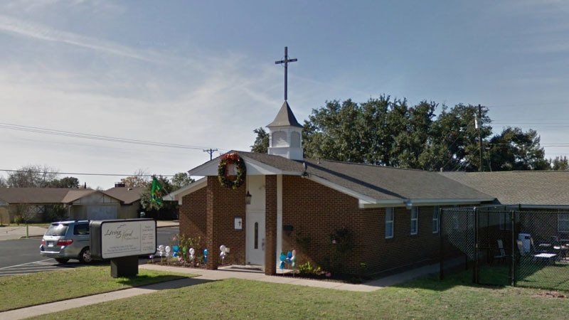 A small church with a cross on top of it