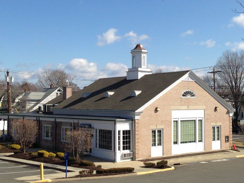 A brick building with a clock tower on top of it