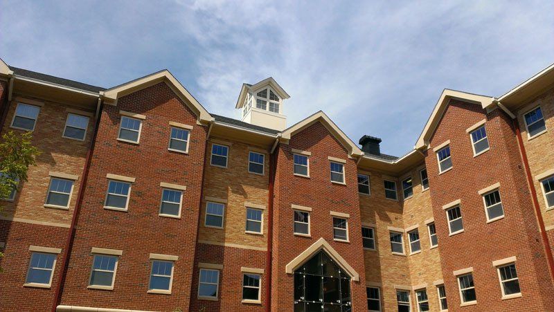 A large brick building with a clock tower on top of it