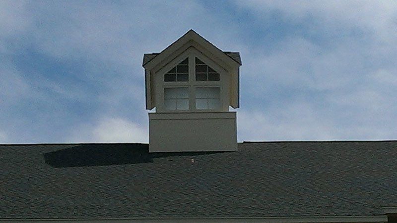 A small window on the roof of a house