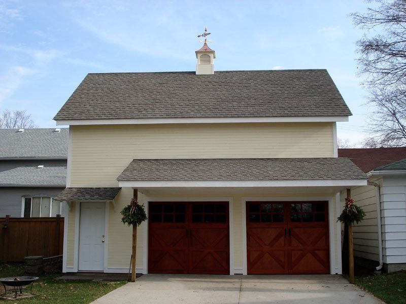 A garage with a roof that has a cross on it