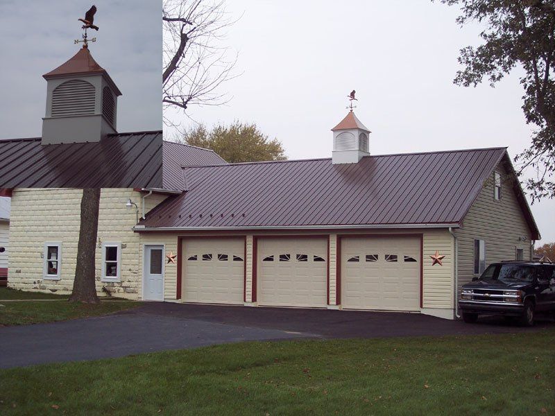 A house with a weather vane on top of it