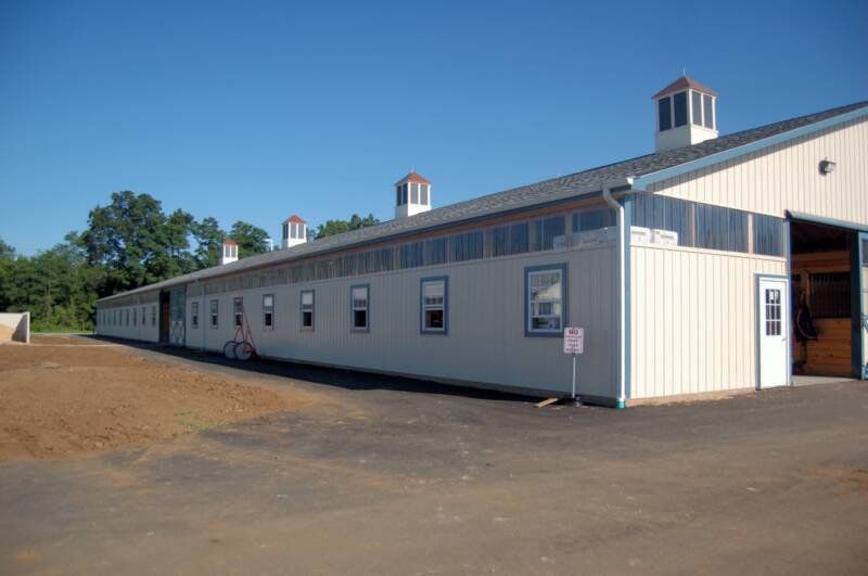 A large white building with a lot of windows and doors