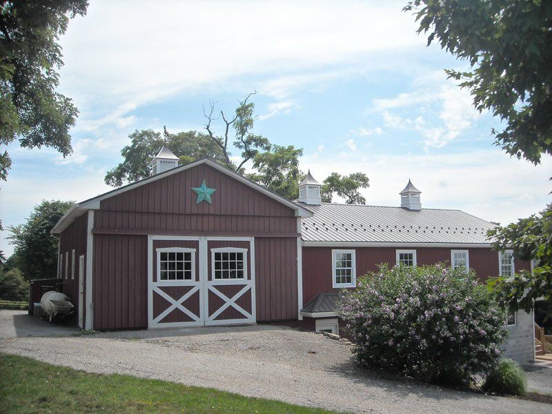 A barn with a star on the top of it