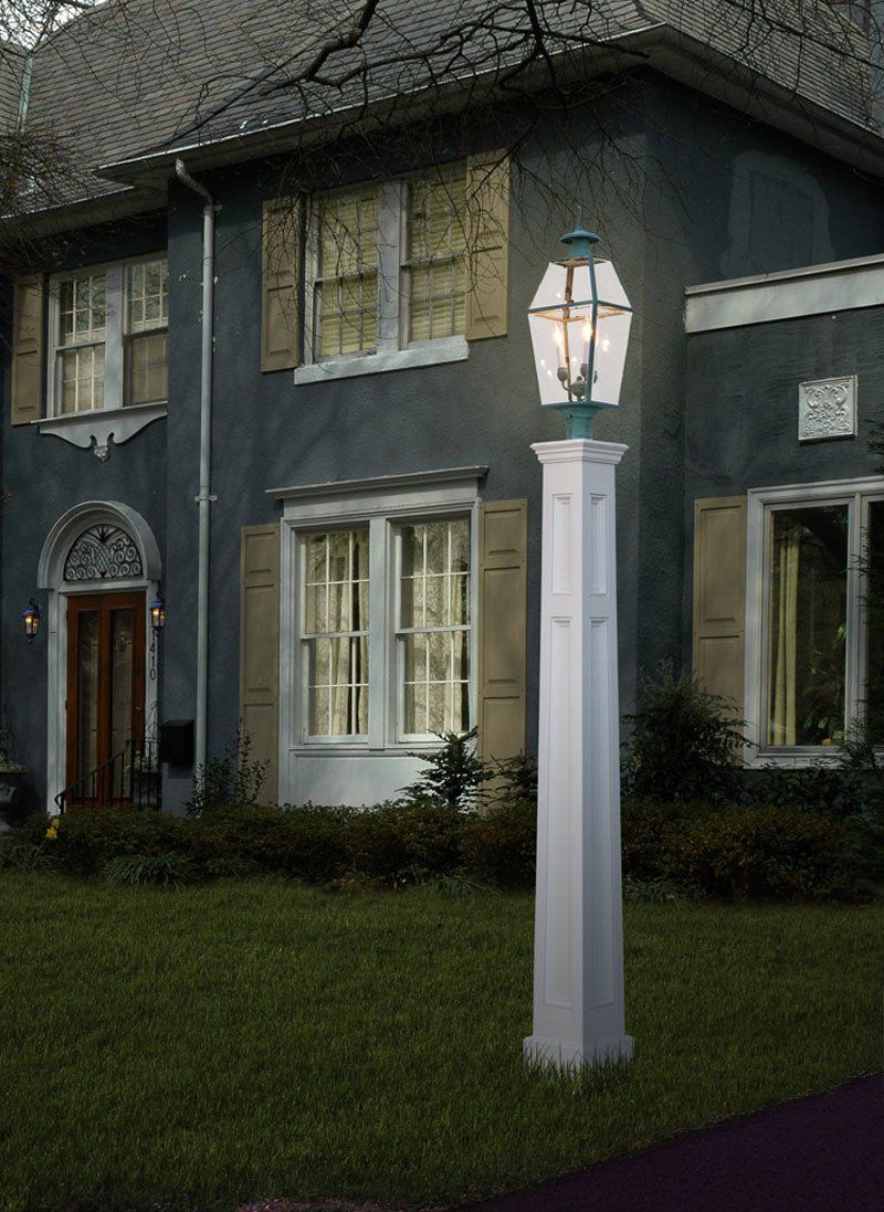 A house with a lamp post in front of it