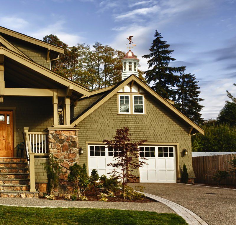 A house with a weather vane on top of it