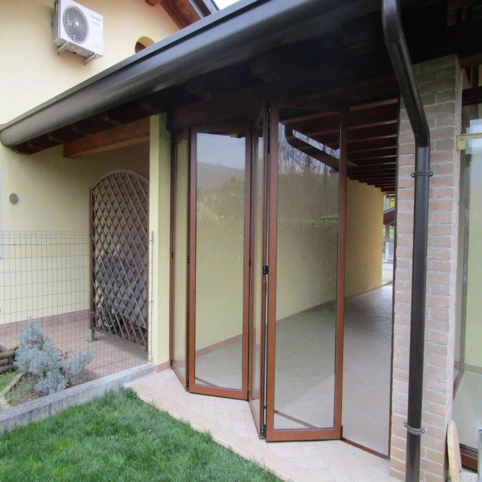 Veranda con apertura a fisarmonica