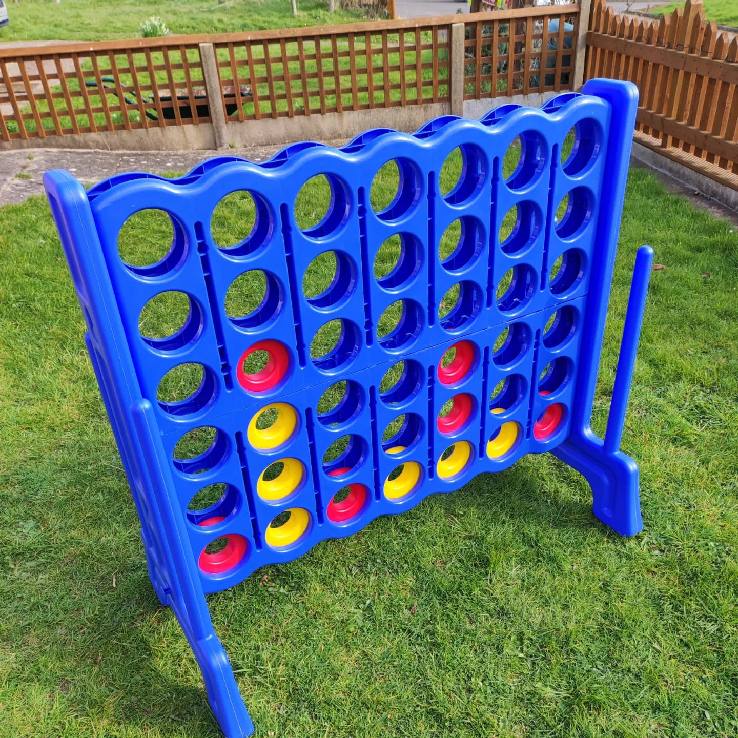 Connect 4 game on green grass