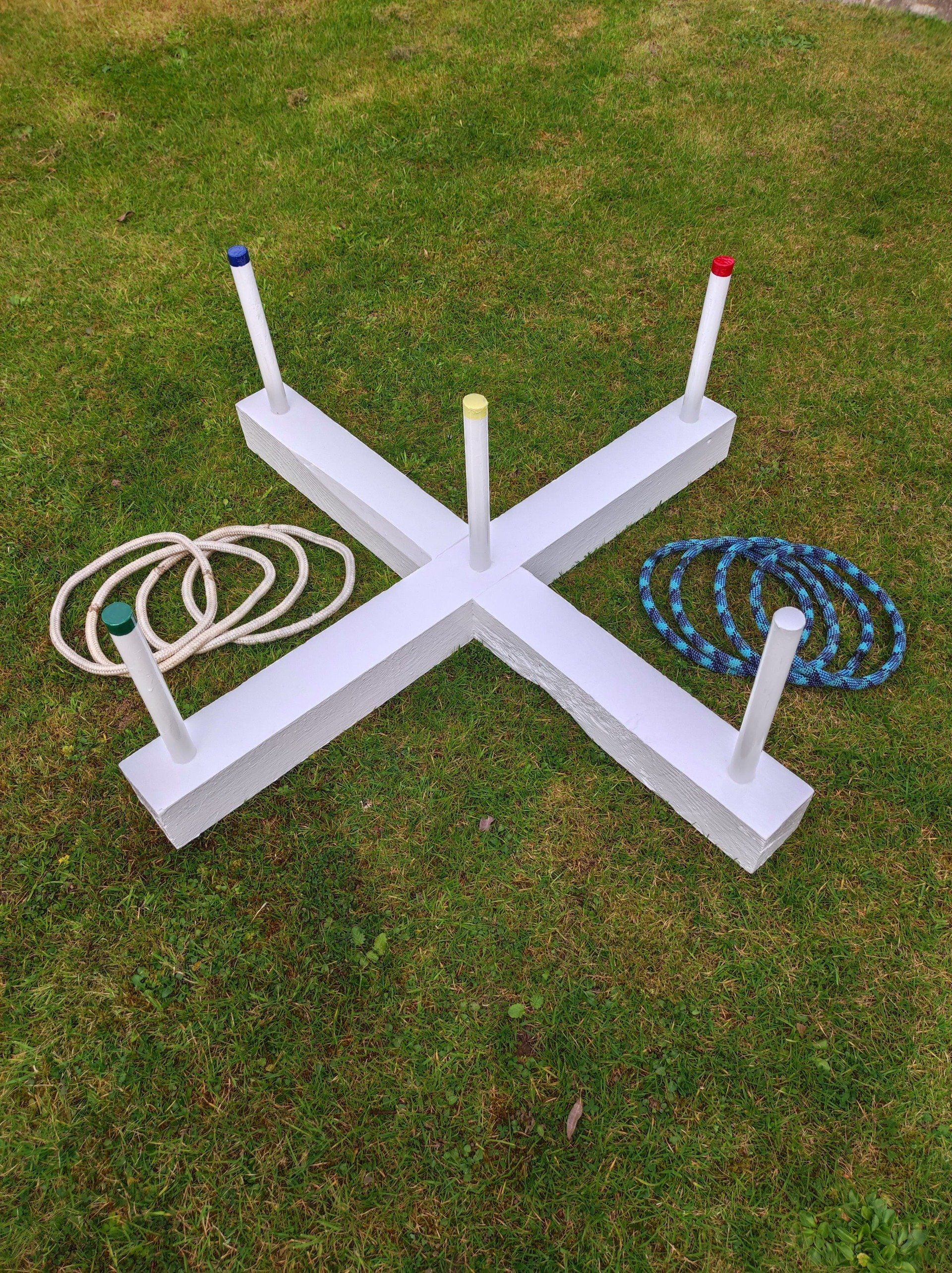 Wooden ring toss in white with circle throwing hoops.