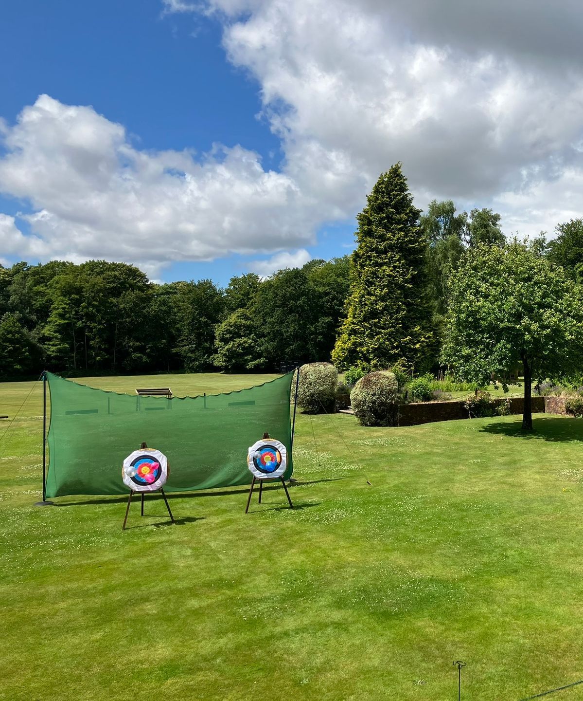 Three archery targets set up for a corporate event at a hotel