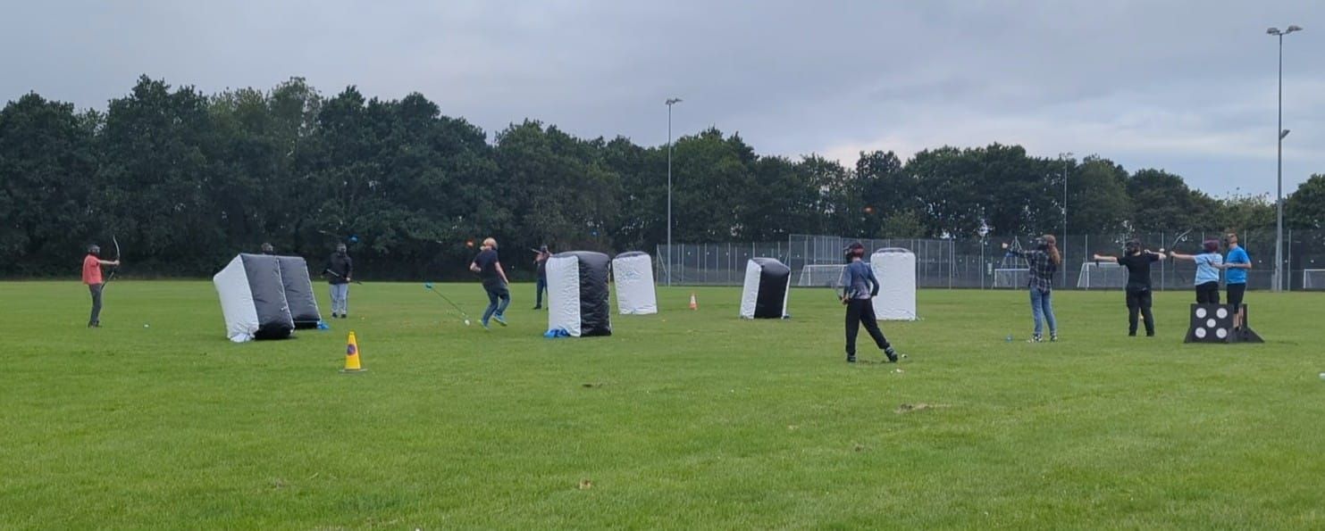 Archery tag set up on a field for a birthday party.