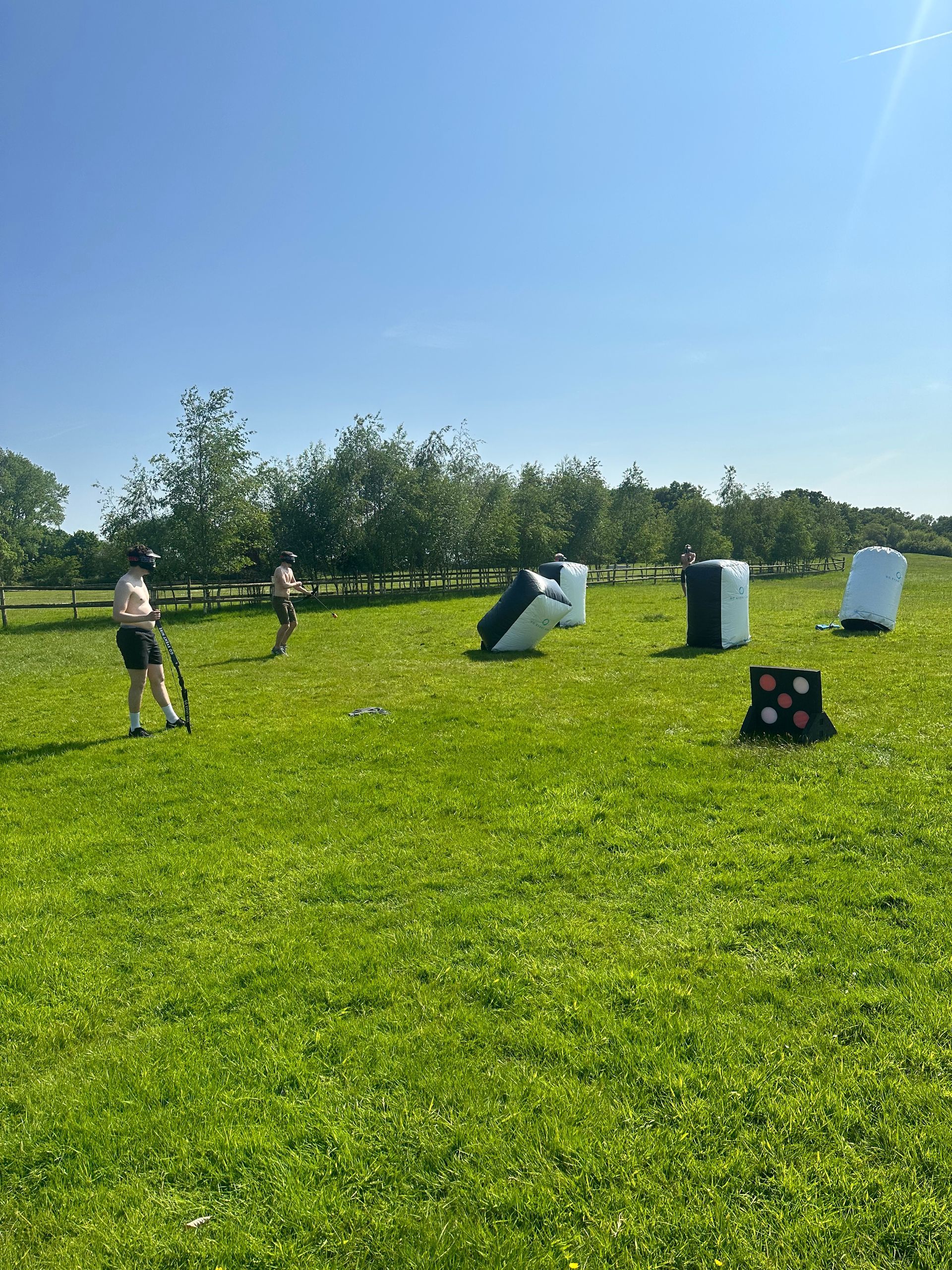 Archery tag set up on a field at House on the Brooks for a stag do.