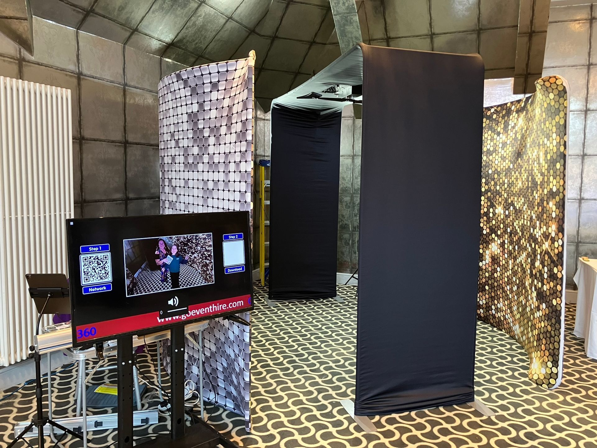 Skylight 360 video booth with sparkly curved backdrops and TV screen