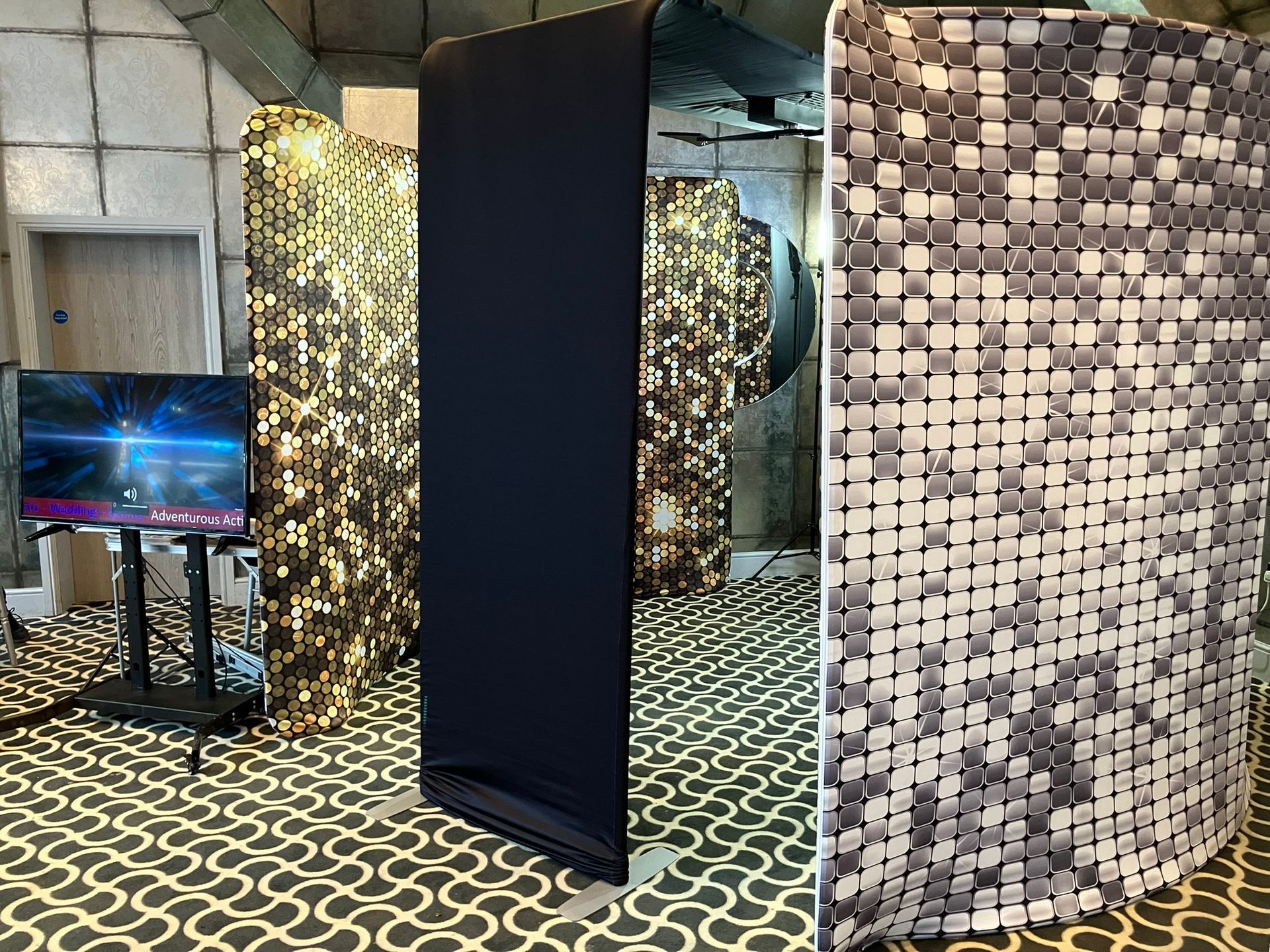 Skylight 360 video booth with sparkly curved backdrops and TV screen