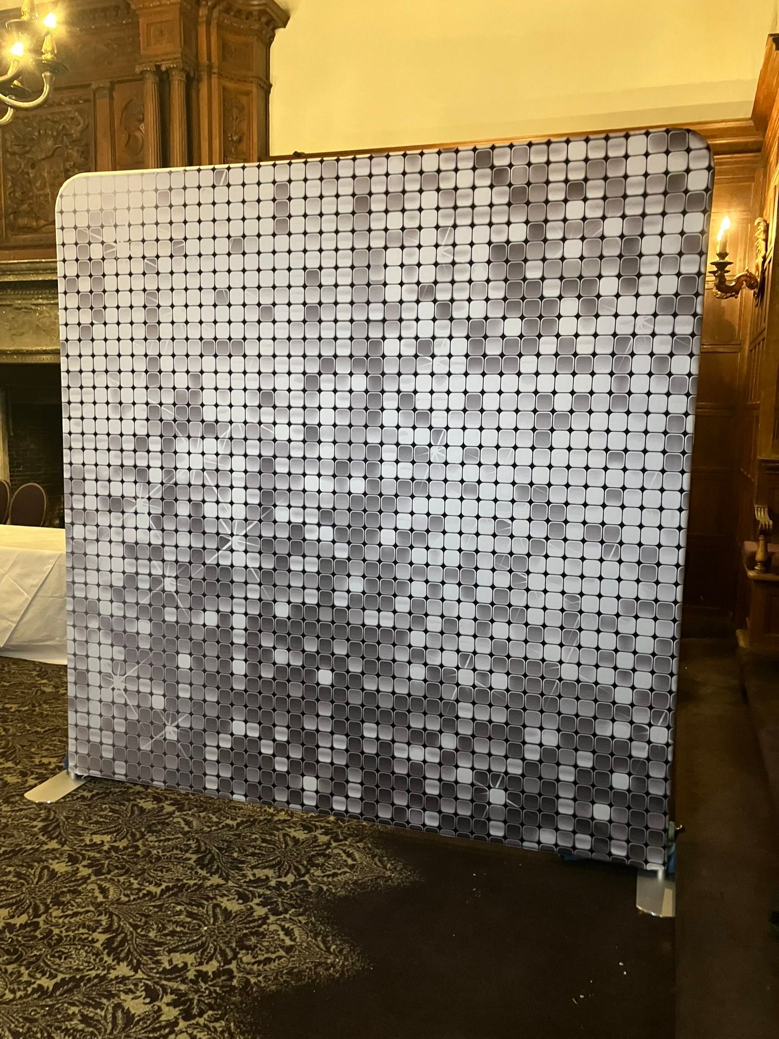 Sparkly silver photo booth backdrop.