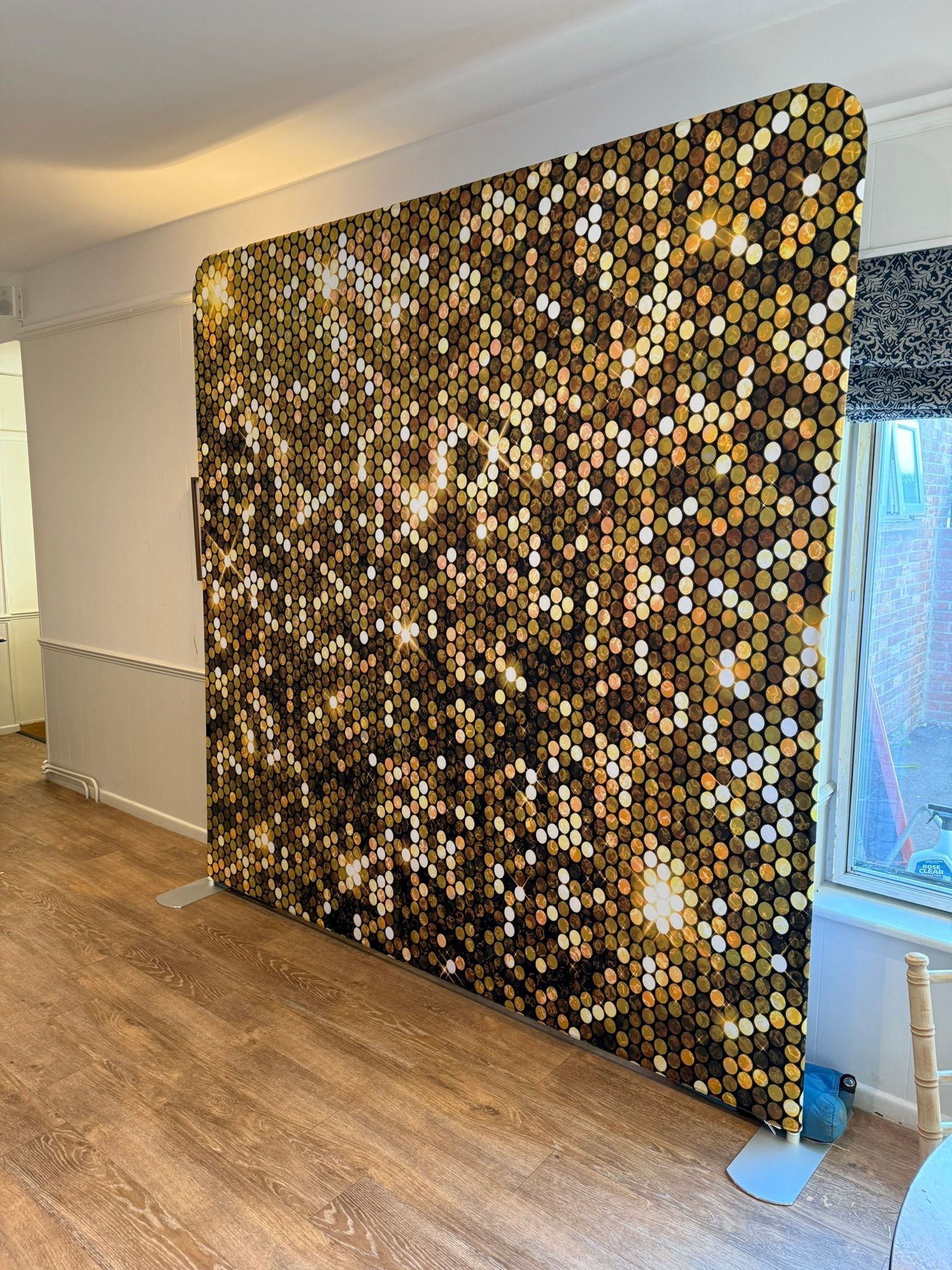 Sparkly gold photobooth backdrop.