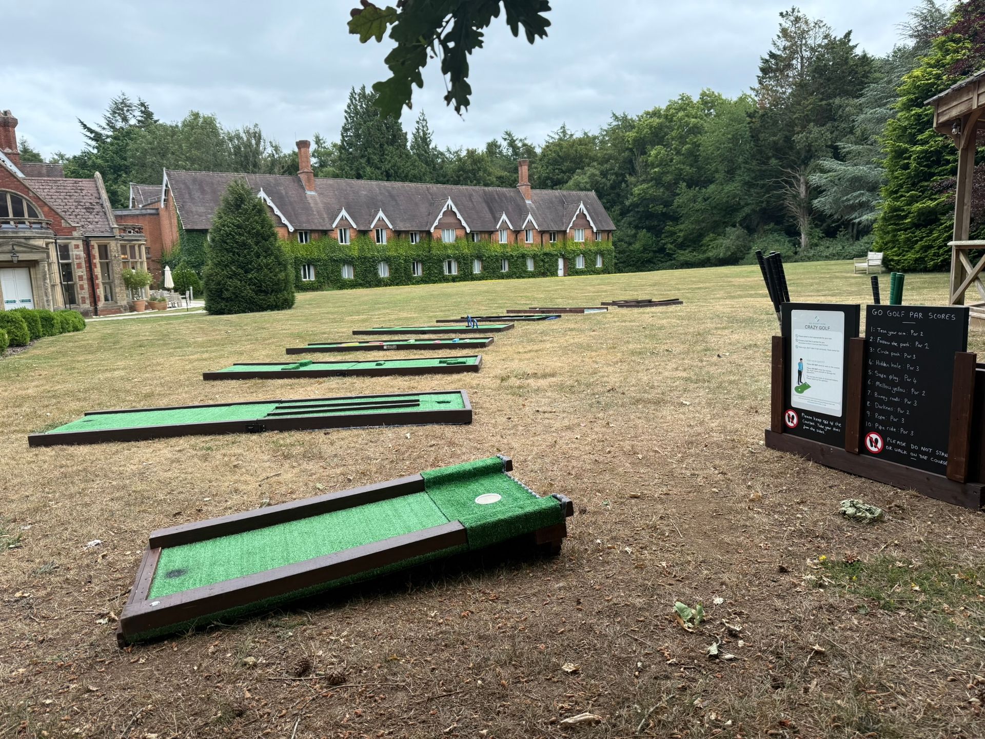 Our red and yellow crazy golf course on green grass.