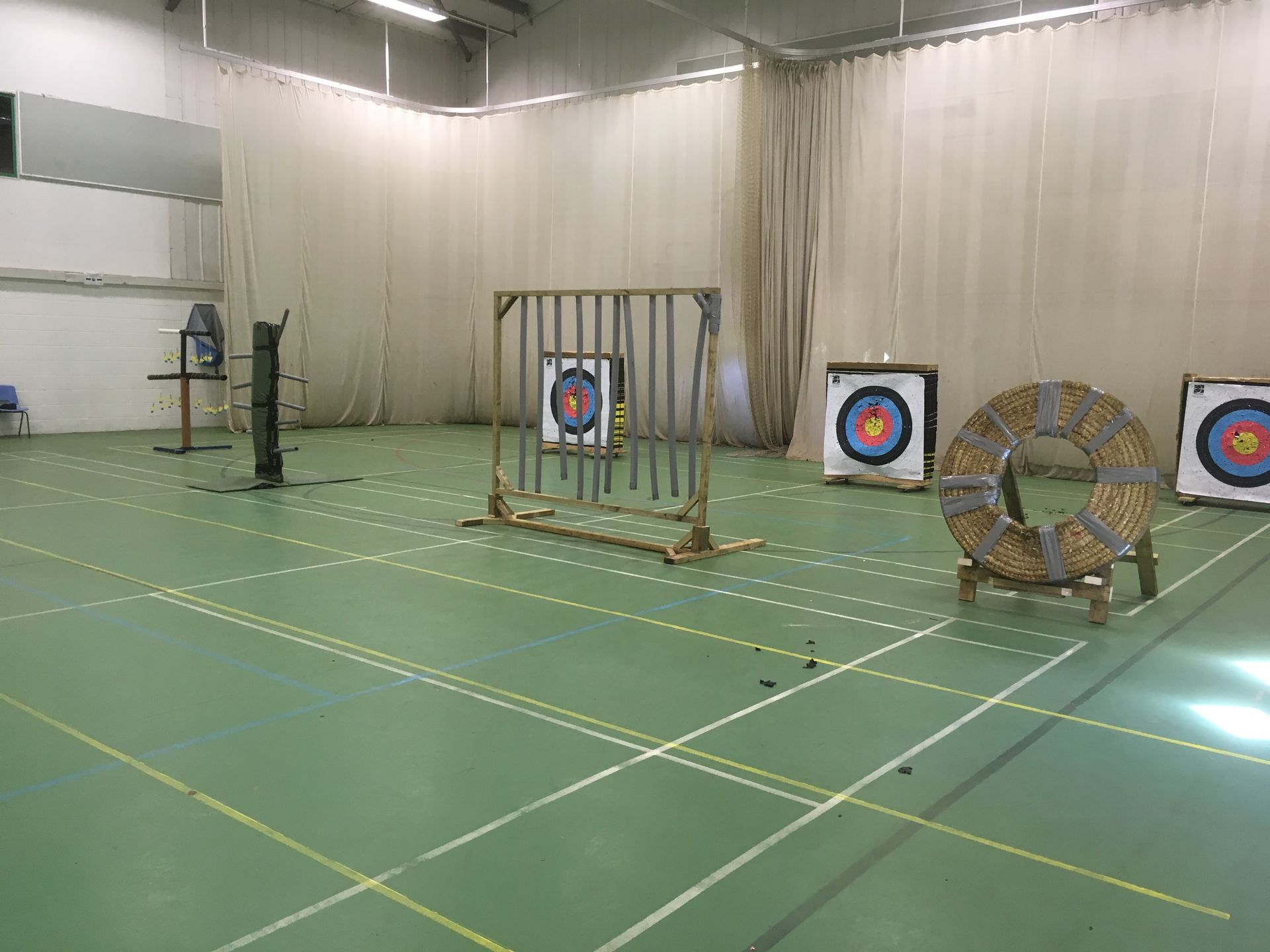 Field archery set up in a sports hall.