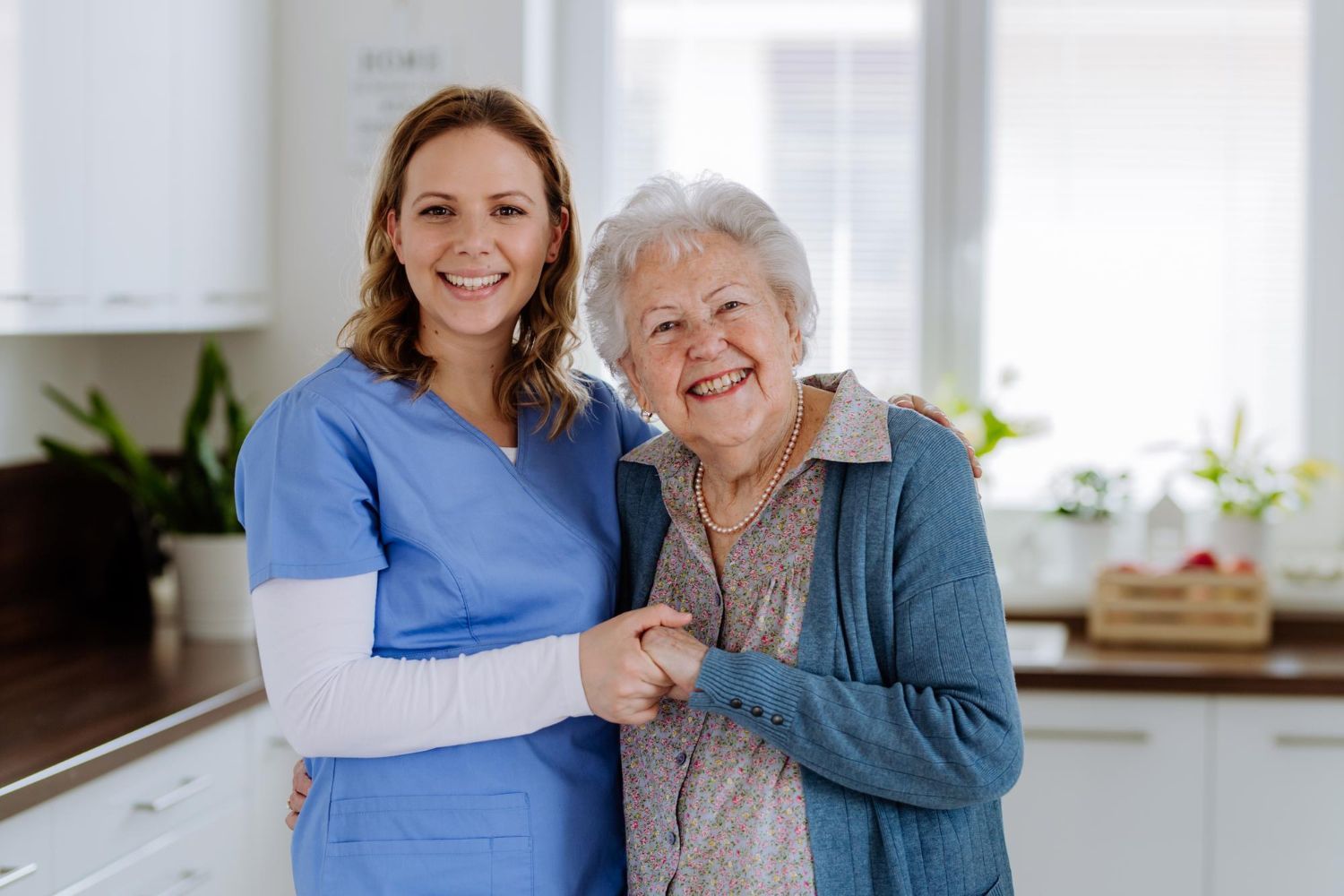 Smiling nurse supporting senior resident at Adrian Bay Rehab & Nursing Center