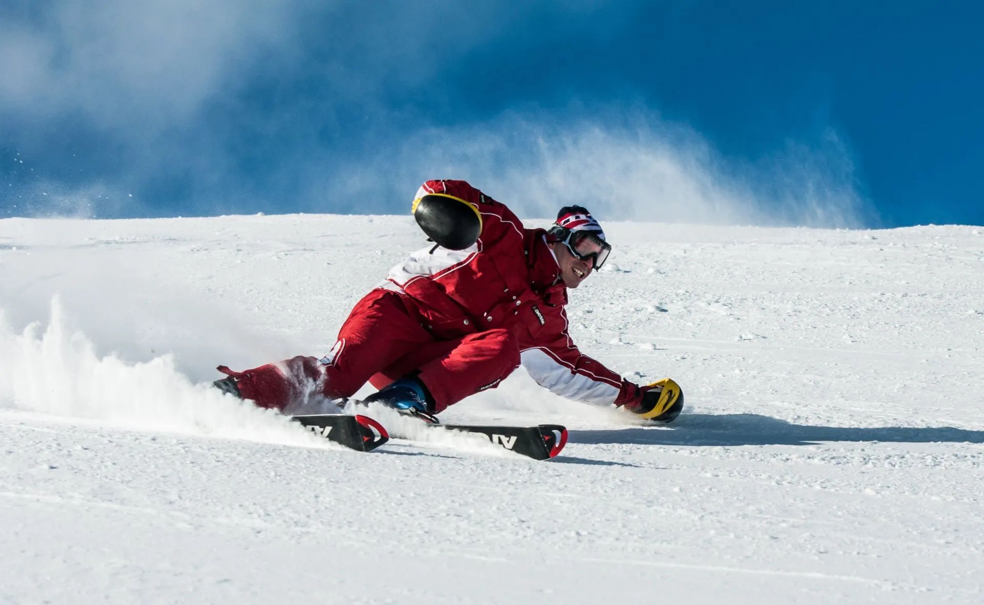 A person is skiing down a snow covered slope.