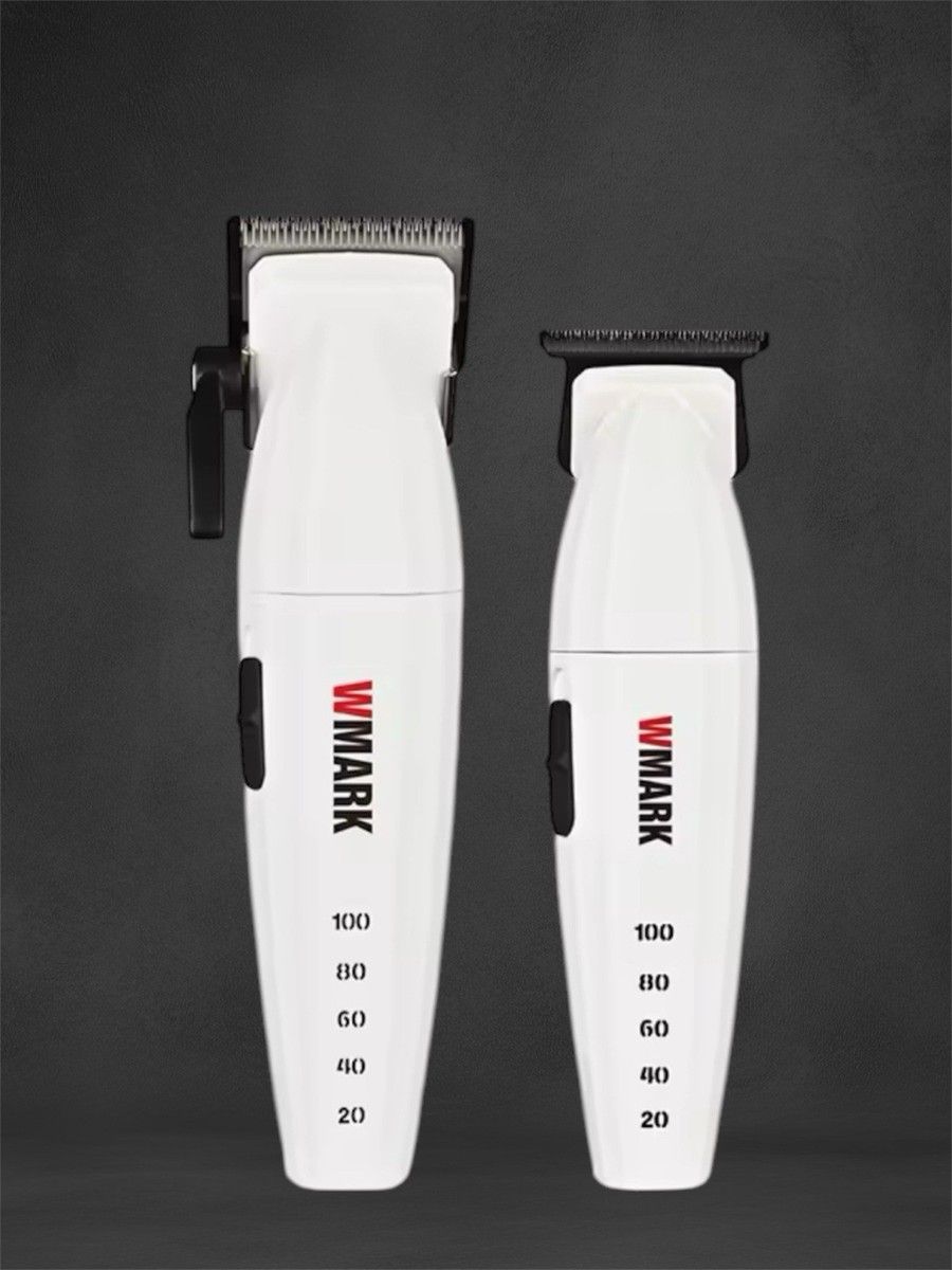 Caja blanca con kit de peluquería de alta velocidad Wmark Specter y tres cortapelos blancos. Fondo azul grisáceo texturizado.