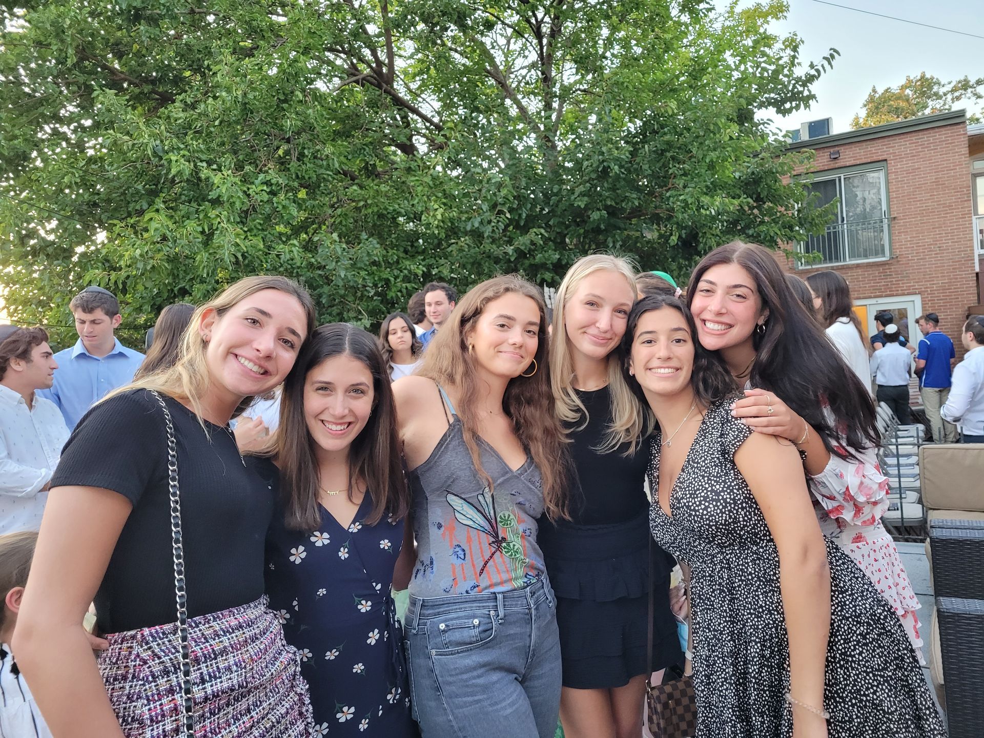 A group of young women are posing for a picture together.