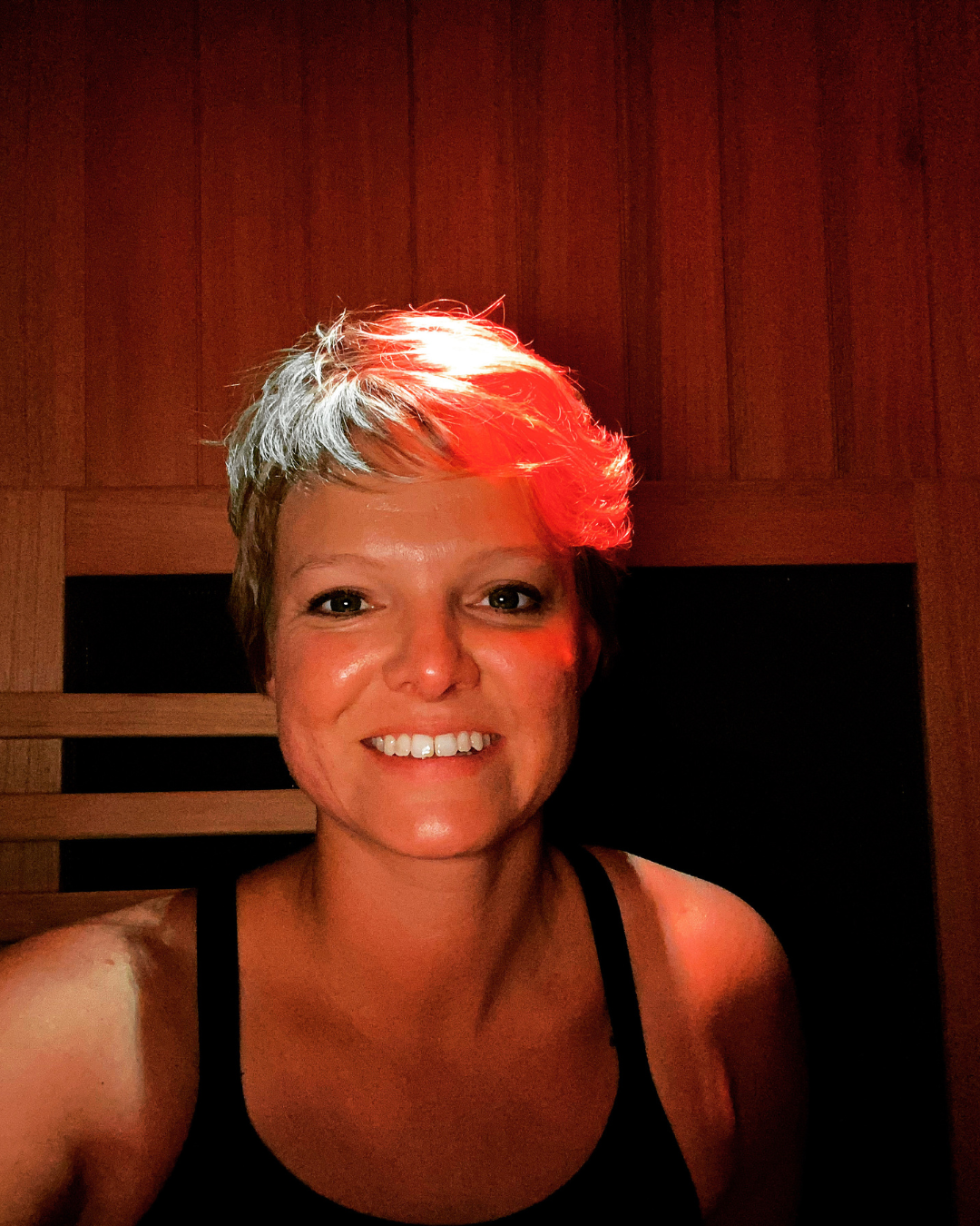 Dr. Kristi Reitz sitting in the sauna
