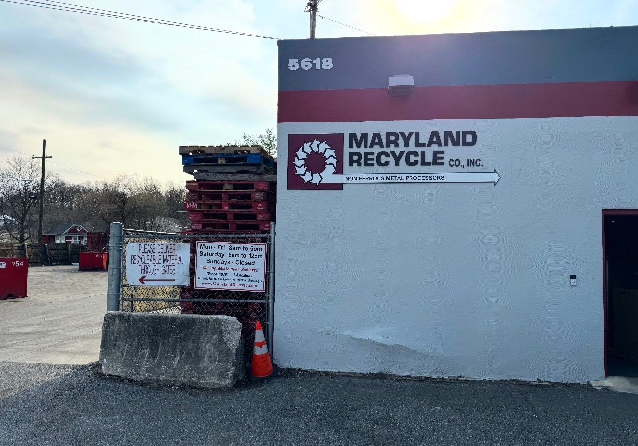 Maryland Recycle Co. facility with a white building, stacked wooden pallets, and signage at 5616.