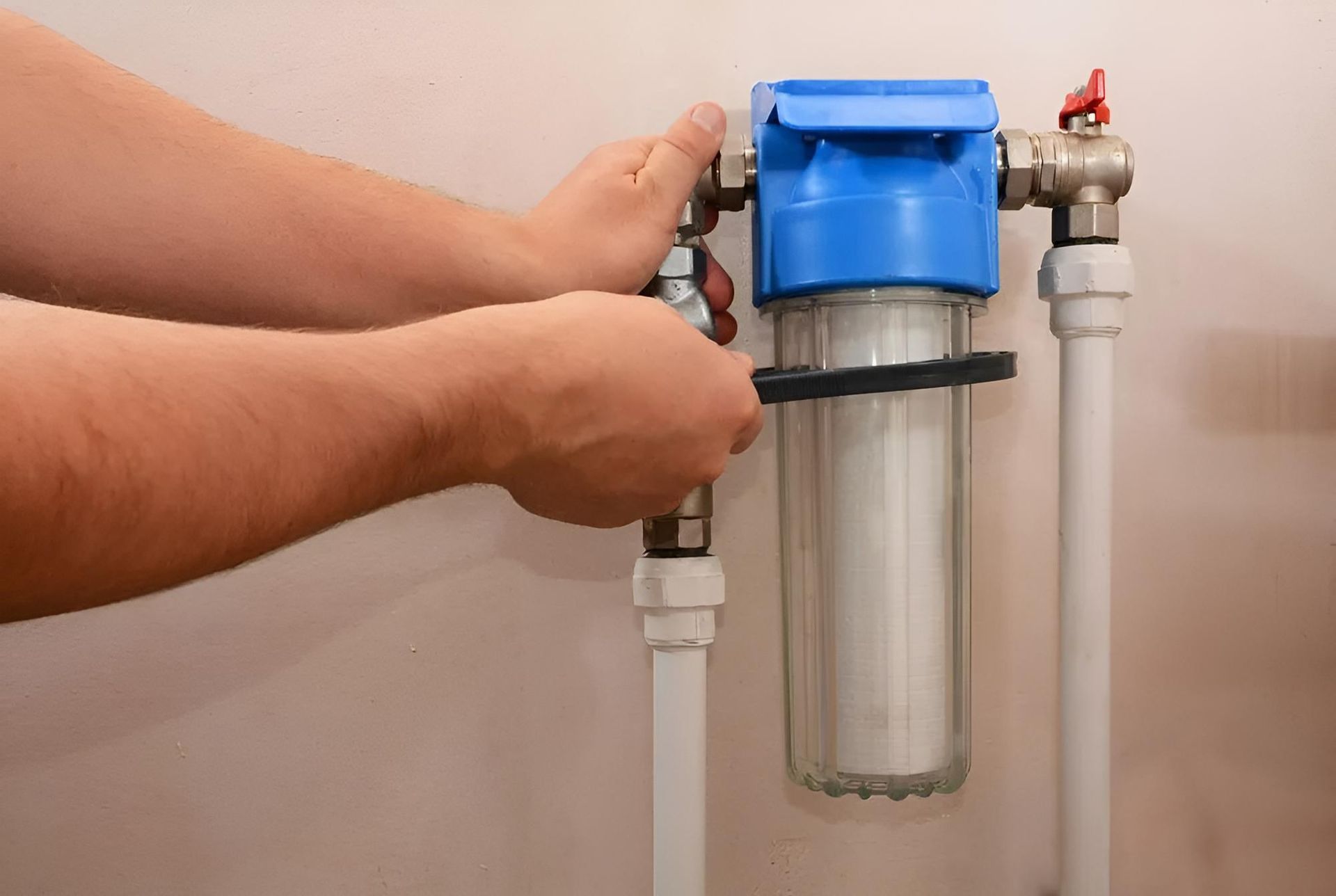 Person is Installing a Water Filter on a Pipe — Wet & Dry Plumbing & Gas in Westbrook, QLD