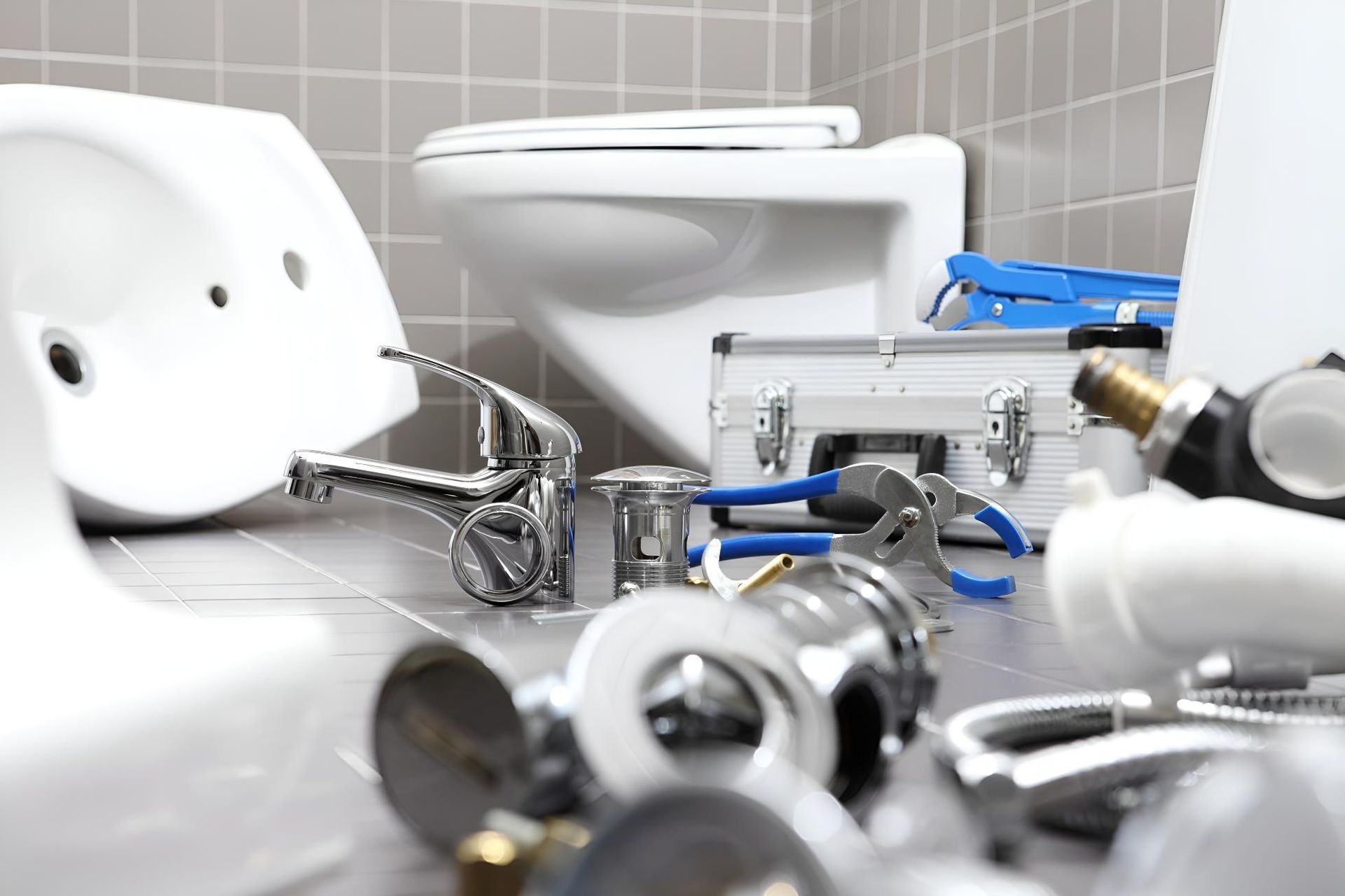 Bathroom With a Toilet, Sink, and Plumbing Tools — Wet & Dry Plumbing & Gas in Newtown, QLD
