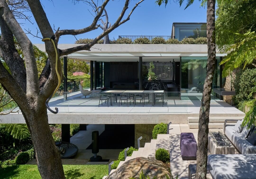 A Modern House With a Lot of Windows and a Tree in Front of It — Vale Building Inspections in Erina, NSW
