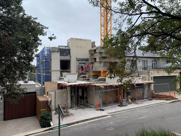 A Building Under Construction With a Crane in the Background — Vale Building Inspections in Forresters Beach, NSW