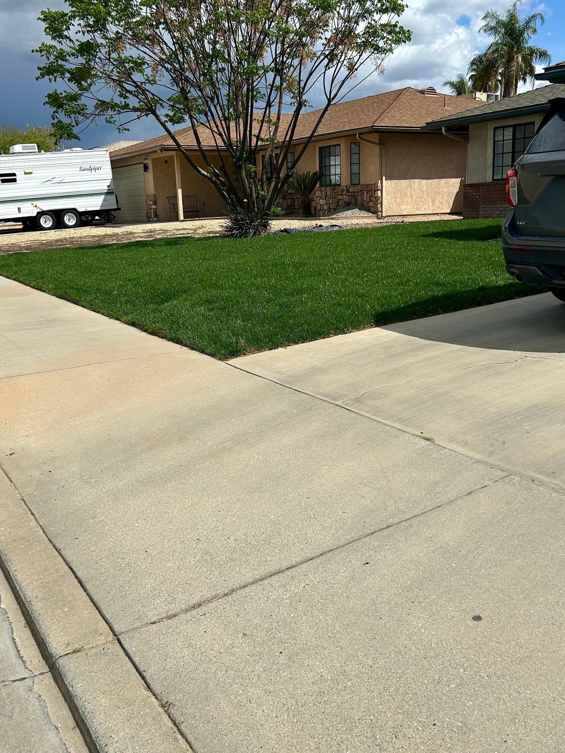 A house with a green lawn.