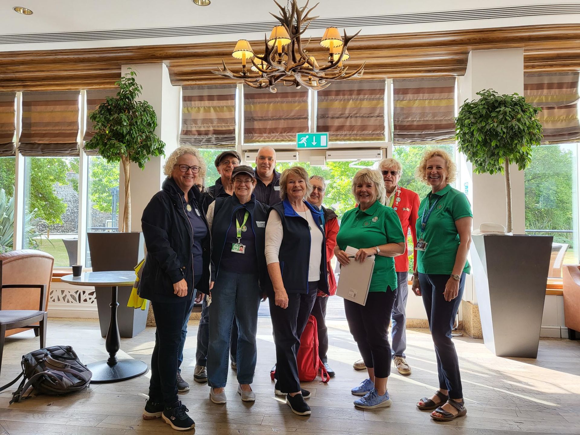 A group of people are posing for a picture in a room.