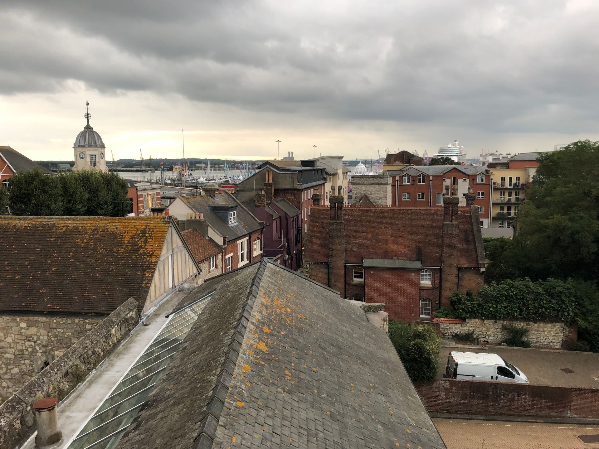 A view of a city from the roof of a building.