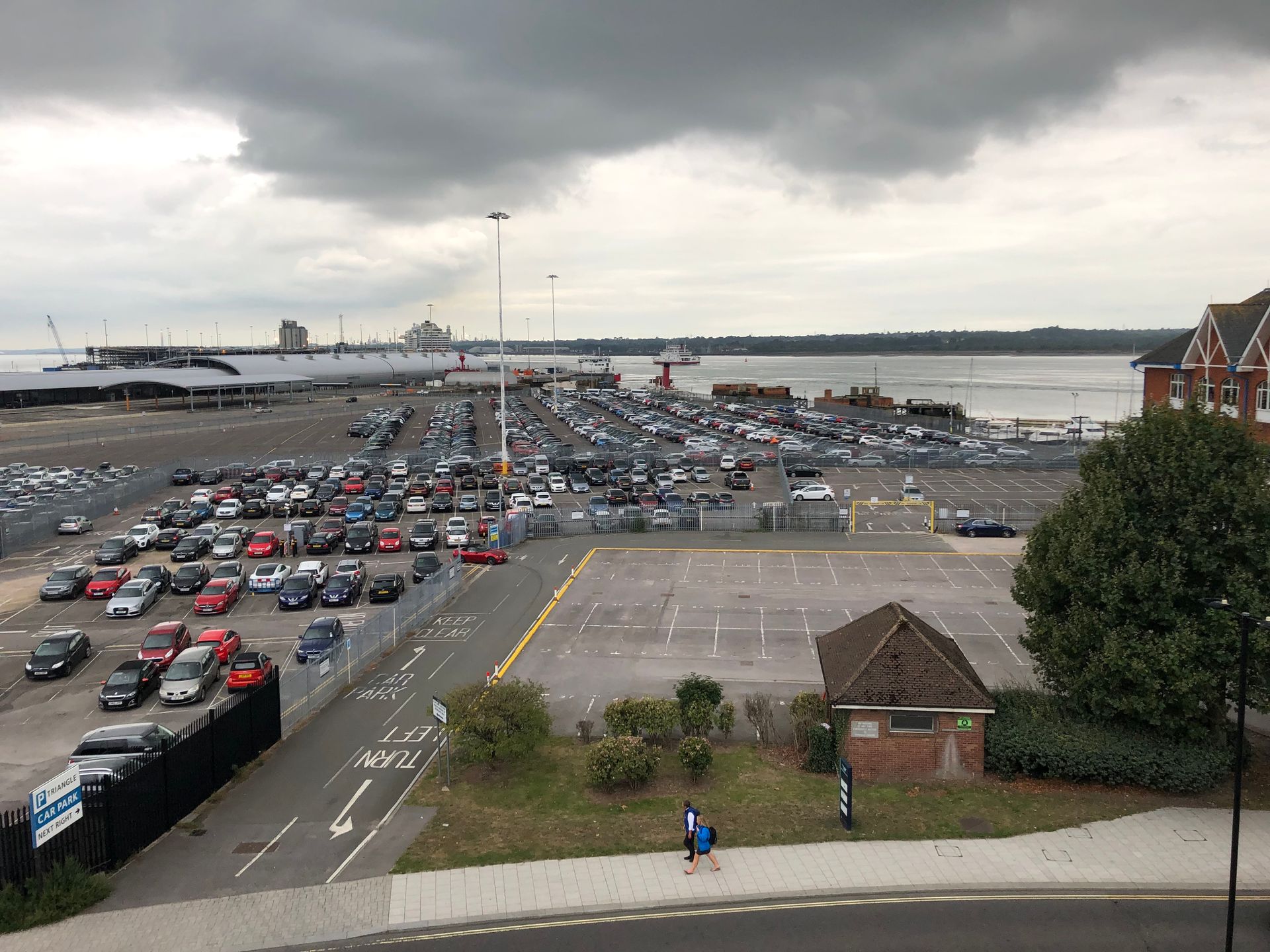 A lot of cars are parked in a parking lot