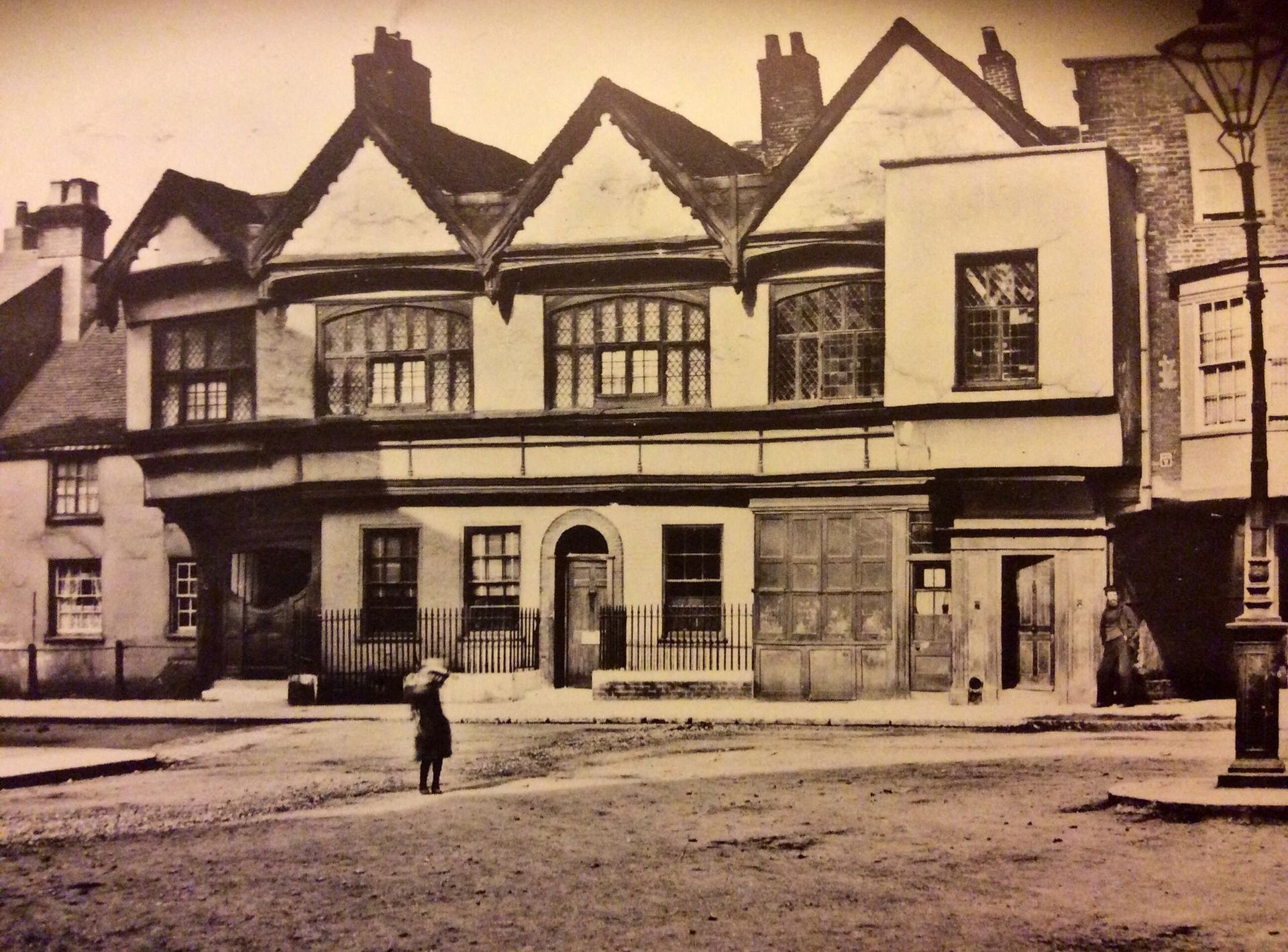 A black and white photo of a row of buildings