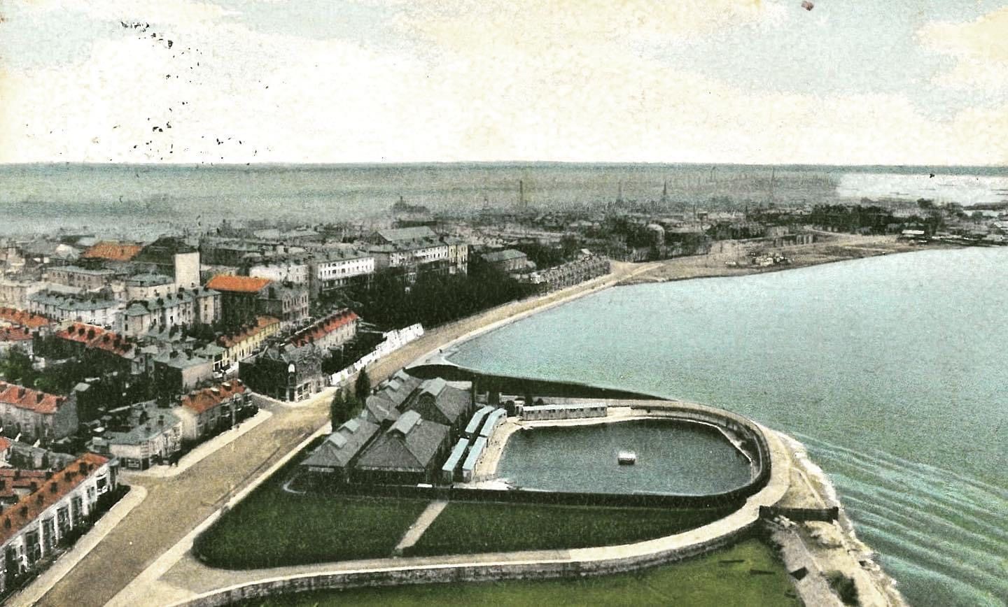 An aerial view of a city and a body of water