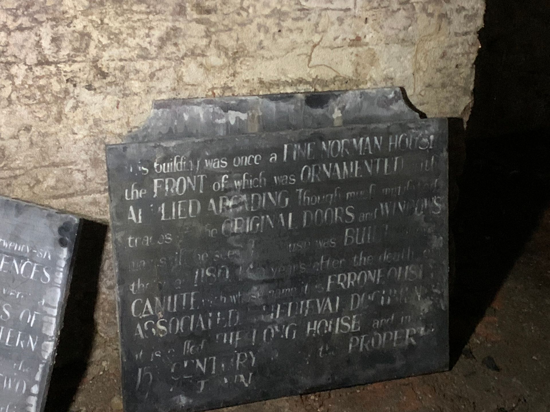 A plaque on a wall that says 